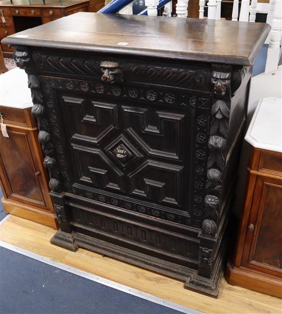 A late 19th century Flemish carved oak pier cabinet W.91cm